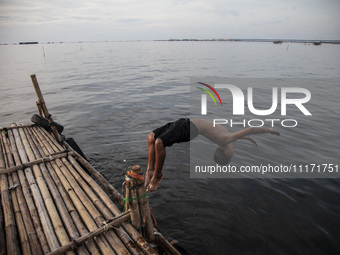 People are enjoying their holiday at Marunda public beach on the north coast of Jakarta, Indonesia, on April 23, 2024. Marunda Beach is the...