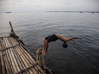 People are enjoying their holiday at Marunda public beach on the north coast of Jakarta, Indonesia, on April 23, 2024. Marunda Beach is the...