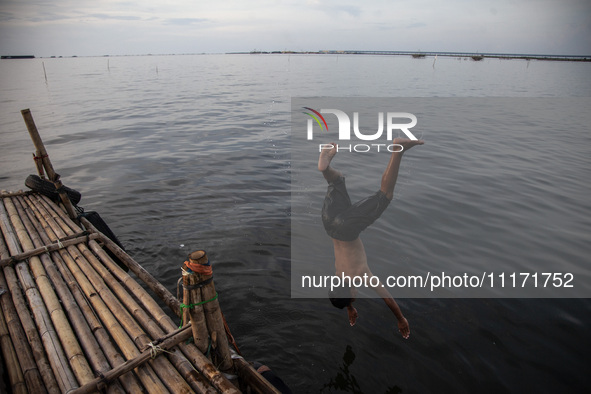 People are enjoying their holiday at Marunda public beach on the north coast of Jakarta, Indonesia, on April 23, 2024. Marunda Beach is the...