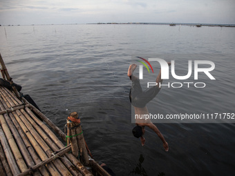 People are enjoying their holiday at Marunda public beach on the north coast of Jakarta, Indonesia, on April 23, 2024. Marunda Beach is the...