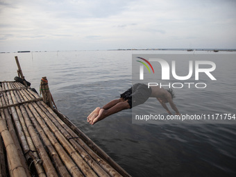 People are enjoying their holiday at Marunda public beach on the north coast of Jakarta, Indonesia, on April 23, 2024. Marunda Beach is the...