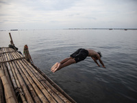 People are enjoying their holiday at Marunda public beach on the north coast of Jakarta, Indonesia, on April 23, 2024. Marunda Beach is the...