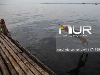 People are enjoying their holiday at Marunda public beach on the north coast of Jakarta, Indonesia, on April 23, 2024. Marunda Beach is the...