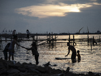 People are enjoying their holiday at Marunda public beach on the north coast of Jakarta, Indonesia, on April 23, 2024. Marunda Beach is the...