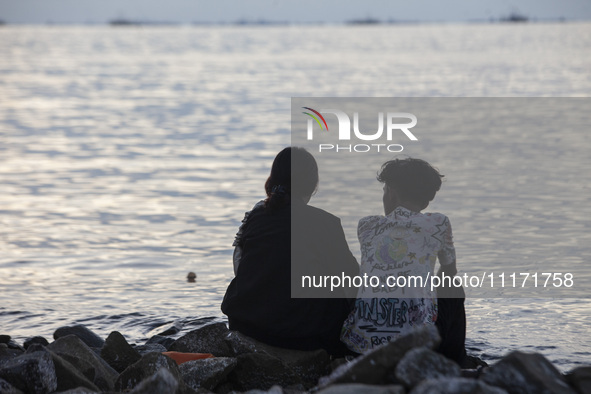 People are enjoying their holiday at Marunda public beach on the north coast of Jakarta, Indonesia, on April 23, 2024. Marunda Beach is the...