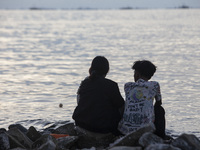 People are enjoying their holiday at Marunda public beach on the north coast of Jakarta, Indonesia, on April 23, 2024. Marunda Beach is the...