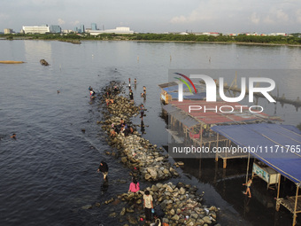 An aerial view is showing Marunda public beach on the north coast of Jakarta, Indonesia, on April 23, 2024. Marunda Beach is the last beach...