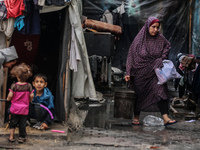 Displaced Palestinians are sheltering in a UNRWA-affiliated school after fleeing their homes due to Israeli strikes, amid the ongoing confli...