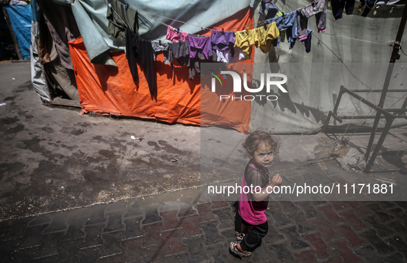 Displaced Palestinian children are playing as they shelter in a UNRWA-affiliated school in Deir Al-Balah, in the central Gaza Strip, on Apri...