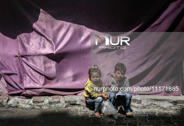 Displaced Palestinian children are playing as they shelter in a UNRWA-affiliated school in Deir Al-Balah, in the central Gaza Strip, on Apri...