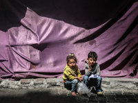 Displaced Palestinian children are playing as they shelter in a UNRWA-affiliated school in Deir Al-Balah, in the central Gaza Strip, on Apri...