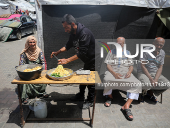 Displaced Palestinians are sheltering in a UNRWA-affiliated school after fleeing their homes due to Israeli strikes, amid the ongoing confli...