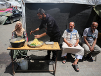 Displaced Palestinians are sheltering in a UNRWA-affiliated school after fleeing their homes due to Israeli strikes, amid the ongoing confli...