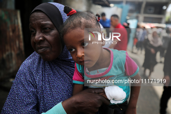 Displaced Palestinians are sheltering in a UNRWA-affiliated school after fleeing their homes due to Israeli strikes, amid the ongoing confli...