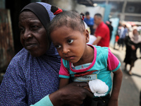 Displaced Palestinians are sheltering in a UNRWA-affiliated school after fleeing their homes due to Israeli strikes, amid the ongoing confli...