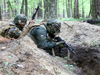 Soldiers are practicing clearing a trench from the enemy in pairs during the drills of the Liut (Fury) Brigade of the National Police of Ukr...