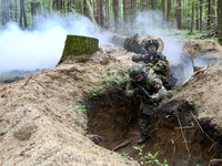 Soldiers are practicing clearing a trench from the enemy in pairs during the drills of the Liut (Fury) Brigade of the National Police of Ukr...