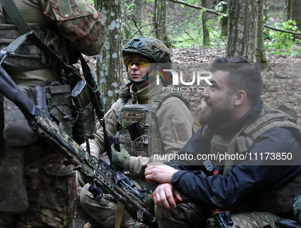 Soldiers are getting ready for the start of the drills of the Liut (Fury) Brigade of the National Police of Ukraine at a training area in th...