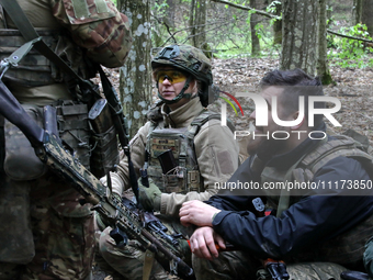 Soldiers are getting ready for the start of the drills of the Liut (Fury) Brigade of the National Police of Ukraine at a training area in th...