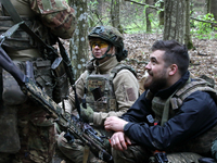 Soldiers are getting ready for the start of the drills of the Liut (Fury) Brigade of the National Police of Ukraine at a training area in th...