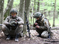 Soldiers are getting ready for the start of the drills of the Liut (Fury) Brigade of the National Police of Ukraine at a training area in th...