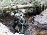 Soldiers are practicing clearing a trench from the enemy in pairs during the drills of the Liut (Fury) Brigade of the National Police of Ukr...