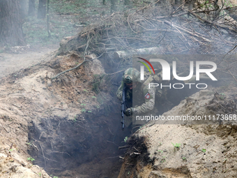 Soldiers are practicing clearing a trench from the enemy in pairs during the drills of the Liut (Fury) Brigade of the National Police of Ukr...