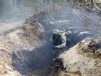 Soldiers are practicing clearing a trench from the enemy in pairs during the drills of the Liut (Fury) Brigade of the National Police of Ukr...