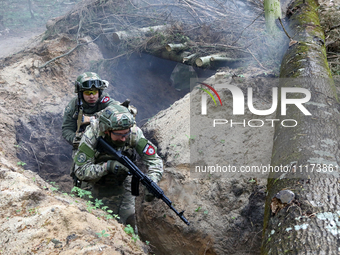 Soldiers are practicing clearing a trench from the enemy in pairs during the drills of the Liut (Fury) Brigade of the National Police of Ukr...