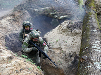 Soldiers are practicing clearing a trench from the enemy in pairs during the drills of the Liut (Fury) Brigade of the National Police of Ukr...