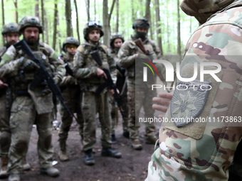 A shoulder sleeve insignia of the Liut (Fury) Brigade of the National Police of Ukraine is being pictured during drills at a training area i...