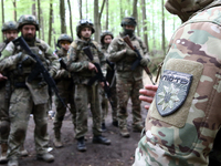 A shoulder sleeve insignia of the Liut (Fury) Brigade of the National Police of Ukraine is being pictured during drills at a training area i...