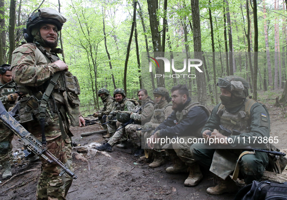 Soldiers are getting ready for the start of the drills of the Liut (Fury) Brigade of the National Police of Ukraine at a training area in th...