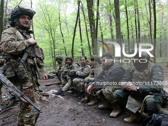 Soldiers are getting ready for the start of the drills of the Liut (Fury) Brigade of the National Police of Ukraine at a training area in th...