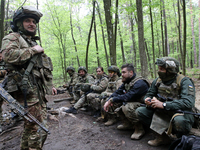 Soldiers are getting ready for the start of the drills of the Liut (Fury) Brigade of the National Police of Ukraine at a training area in th...