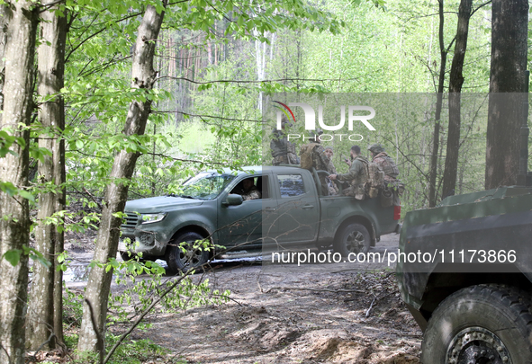 Soldiers are getting ready for the start of the drills of the Liut (Fury) Brigade of the National Police of Ukraine at a training area in th...