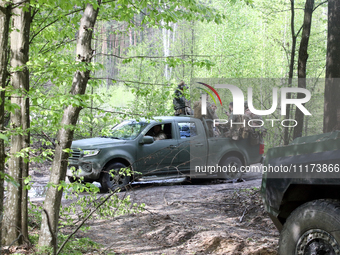 Soldiers are getting ready for the start of the drills of the Liut (Fury) Brigade of the National Police of Ukraine at a training area in th...