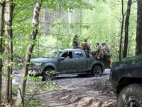 Soldiers are getting ready for the start of the drills of the Liut (Fury) Brigade of the National Police of Ukraine at a training area in th...