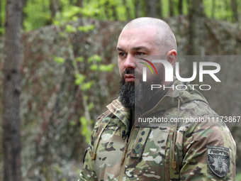 Commander of the Liut (Fury) Brigade of the National Police of Ukraine, Andrii Matviienko, is speaking to the press during drills at a train...