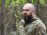 Commander of the Liut (Fury) Brigade of the National Police of Ukraine, Andrii Matviienko, is speaking to the press during drills at a train...