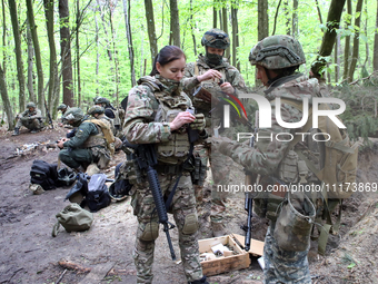 Soldiers are getting ready for the start of the drills of the Liut (Fury) Brigade of the National Police of Ukraine at a training area in th...