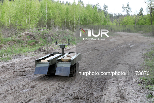 The VEPR ground logistics robotic complex, which is used for delivering mines and evacuating the wounded, is being pictured during drills of...