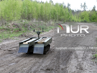 The VEPR ground logistics robotic complex, which is used for delivering mines and evacuating the wounded, is being pictured during drills of...