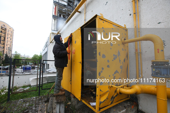 A man is repairing equipment in the Shevchenkivskyi district after a Russian missile attack in Kharkiv, Ukraine, on April 24, 2024. 