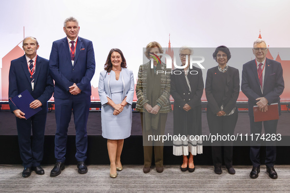 Queen Sofia of Spain, HRH Princess Muna Al Hussein of Jordan, Paola Barbarino, Wojciech Konieczny and Zbigniew Tomczak pose for a family pho...