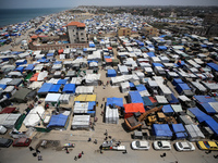 Palestinians are taking shelter in a tent camp in Deir Balah in the central Gaza Strip on April 24, 2024, after fleeing their homes due to I...