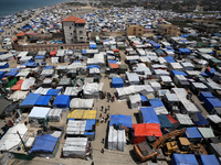 Palestinians are taking shelter in a tent camp in Deir Balah in the central Gaza Strip on April 24, 2024, after fleeing their homes due to I...