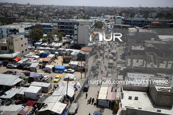 Palestinians are taking shelter in a tent camp in Deir Balah in the central Gaza Strip on April 24, 2024, after fleeing their homes due to I...