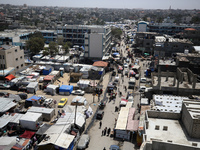 Palestinians are taking shelter in a tent camp in Deir Balah in the central Gaza Strip on April 24, 2024, after fleeing their homes due to I...