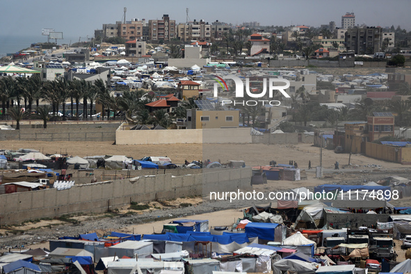 Palestinians are taking shelter in a tent camp in Deir Balah in the central Gaza Strip on April 24, 2024, after fleeing their homes due to I...